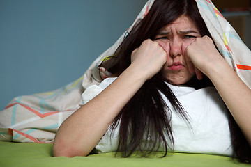 Image showing Woman with blanket under her head