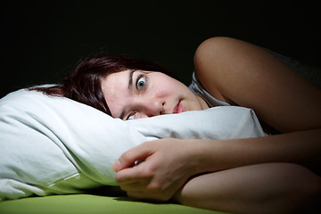 Image showing Young woman in bed  eyes opened suffering insomnia. Nightmare issues