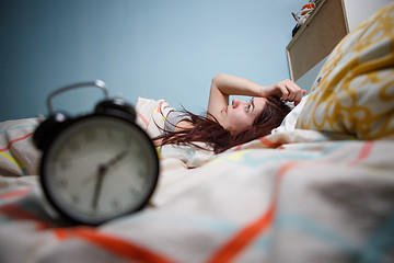 Image showing Woman with insomnia touching her head