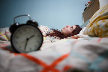 Image showing Woman with insomnia touching her head