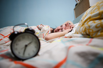 Image showing Woman with insomnia touching her head