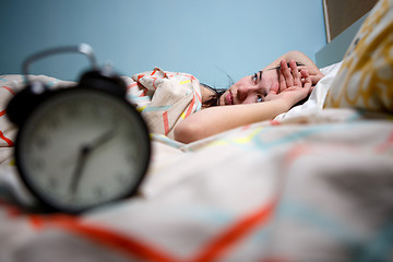 Image showing Woman with insomnia touching her head