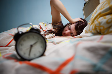 Image showing Woman with insomnia touching her head