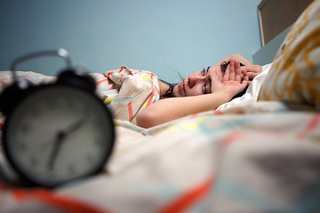 Image showing Woman with insomnia touching her head