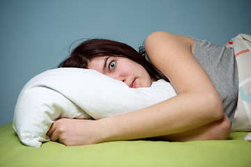 Image showing Young woman in bed  eyes opened suffering insomnia. Nightmare issues