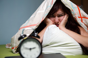 Image showing Woman with blanket under her head