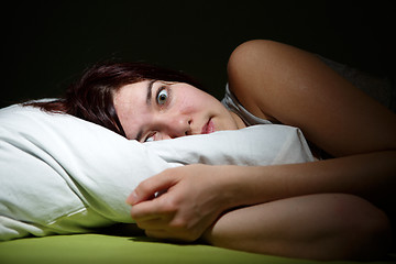 Image showing Young woman in bed  eyes opened suffering insomnia. Nightmare issues