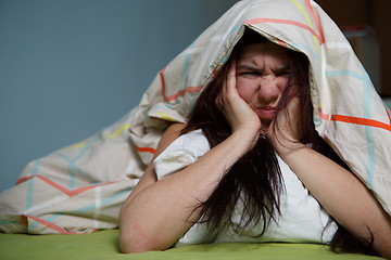 Image showing Woman with blanket under her head