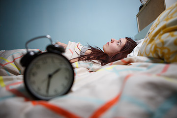 Image showing Woman with insomnia touching her head