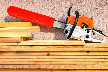 Image showing Chainsaw and lumber.