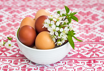 Image showing Easter eggs on the table in a ceramic vase.