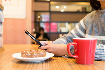 Image showing Woman use of the cellphone at coffee shop