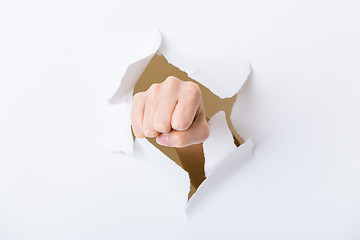 Image showing Paper breakthough by woman punch