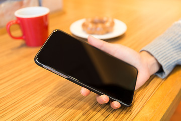 Image showing Woman hand holding blank screen of cellphone