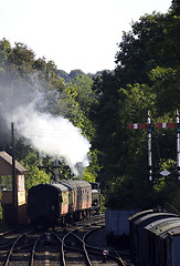 Image showing Steam train pulling carriages