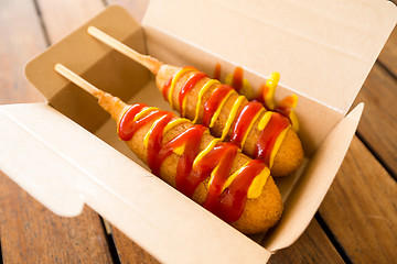 Image showing Corn dog in paper box