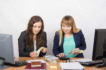 Image showing For office table girl enthusiastically believe the money