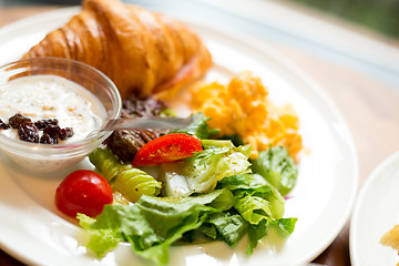 Image showing Fresh croissants with salad