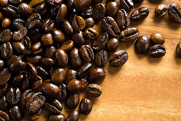 Image showing Roasted coffee bean against wooden background