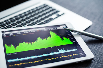 Image showing Stock market data analyzing on tablet pc