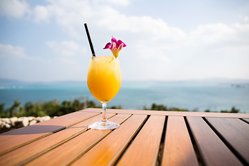 Image showing Orange juice at seaside restaurant