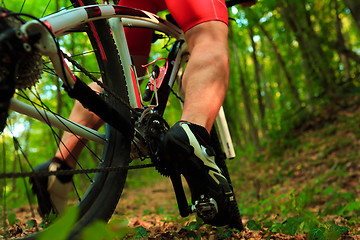 Image showing cyclist riding mountain bike on rocky trail