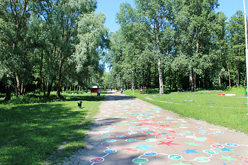 Image showing People have a rest in park with big trees