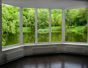 Image showing modern window of veranda overlooking the river 
