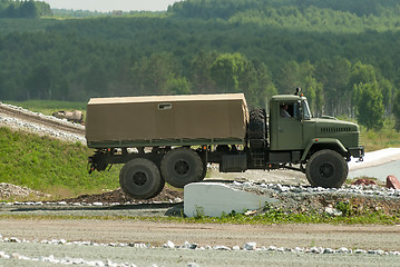 Image showing Curtain sided truck comes around on high obstacle