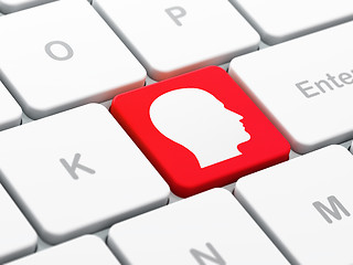 Image showing Advertising concept: Head on computer keyboard background