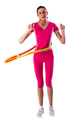 Image showing woman rotates hula hoop on white background