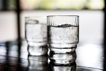Image showing Glass of water on table in restaurant