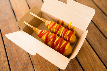 Image showing Corn dog in paper box