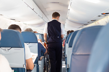 Image showing Steward on the airplane.