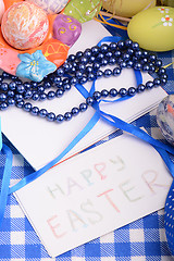 Image showing Easter eggs and invitation note. happy easter