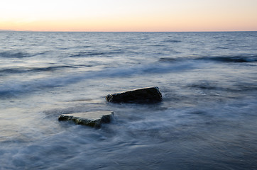 Image showing Rocks in milky water