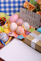 Image showing hand made eggs at a gift box, happy easter invitation card