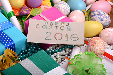 Image showing easter eggs with flowers and gift box 