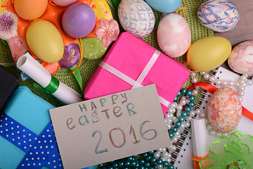 Image showing easter eggs with flowers and gift box 