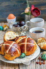 Image showing Breakfast with the Easter buns with raisins.