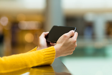 Image showing Closeup of female hand using smart phone