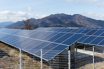 Image showing Solar power plant with mountain background