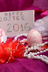 Image showing Easter eggs and flowers on background with gift box