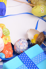 Image showing Assorted Easter coloured eggs in the paper egg box