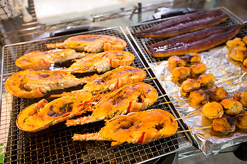 Image showing Roasted lobster and scallop at fish market