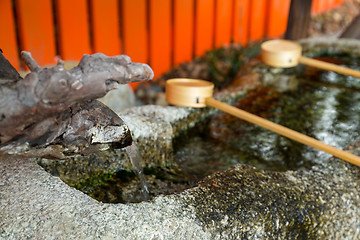 Image showing Ladles used for purification of the hands at Japanese temples