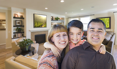 Image showing Young Mixed Race Family Portrait In Living Room of Home