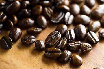 Image showing Roasted coffee bean on grunge wood table