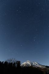 Image showing Starry night with snow mountain