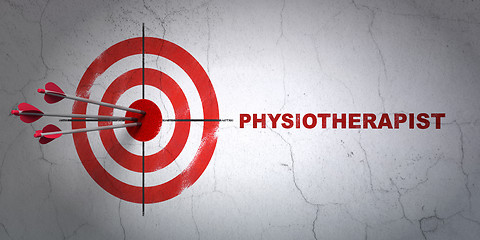 Image showing Health concept: target and Physiotherapist on wall background